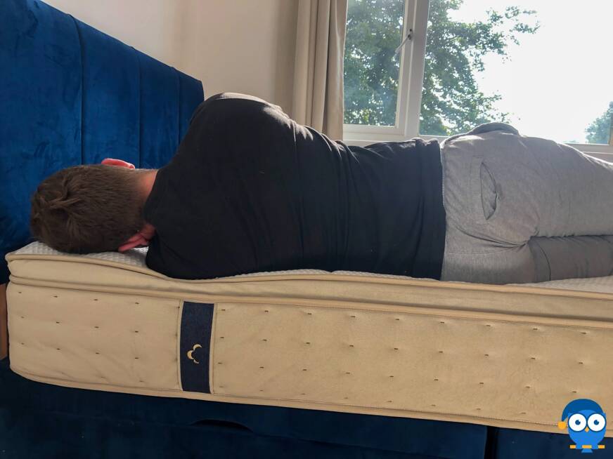Man laying on side on DreamCloud mattress
